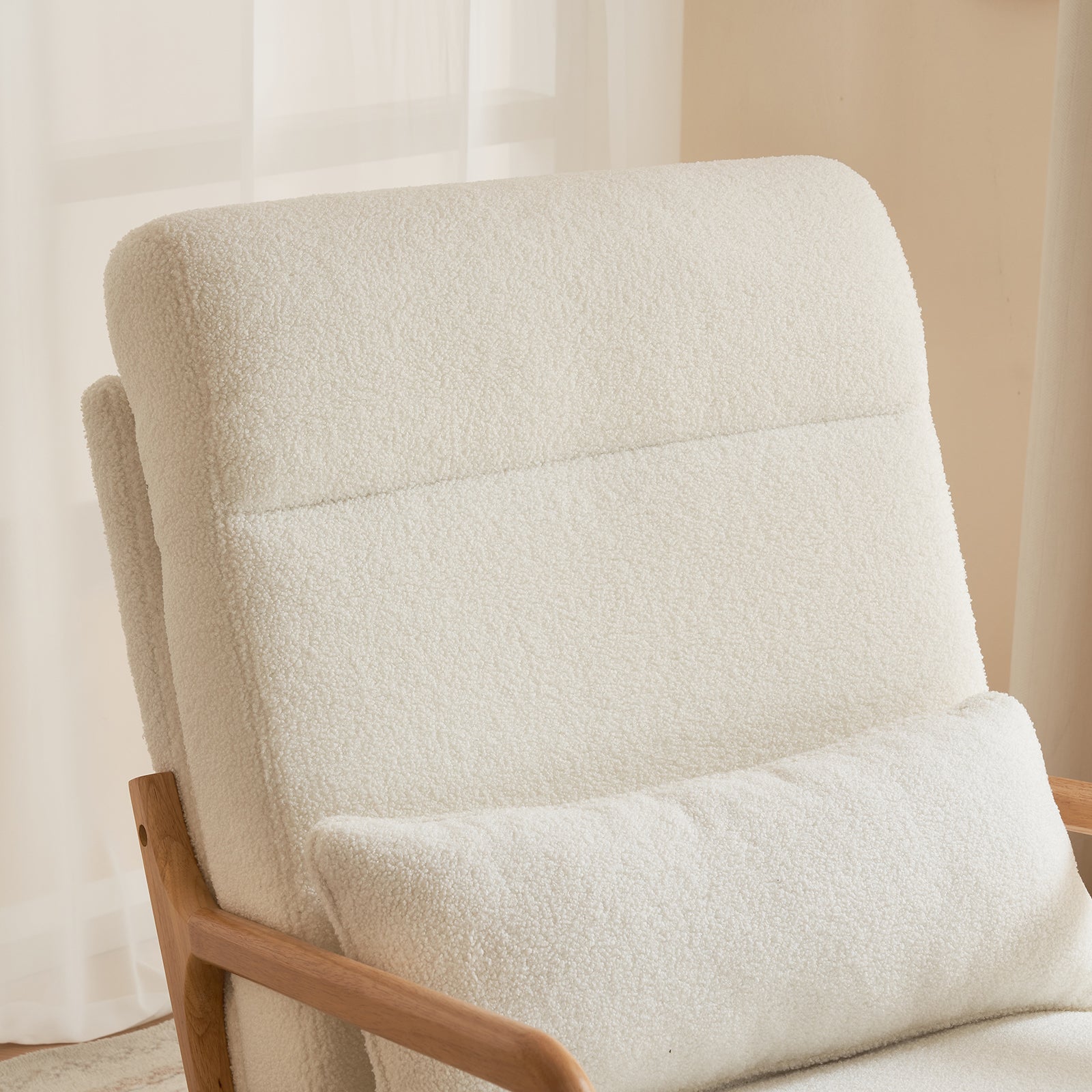 Close-up of the back of the Comfy Rocking Chair featuring a high back design and the included lumbar pillow for enhanced support and comfort.