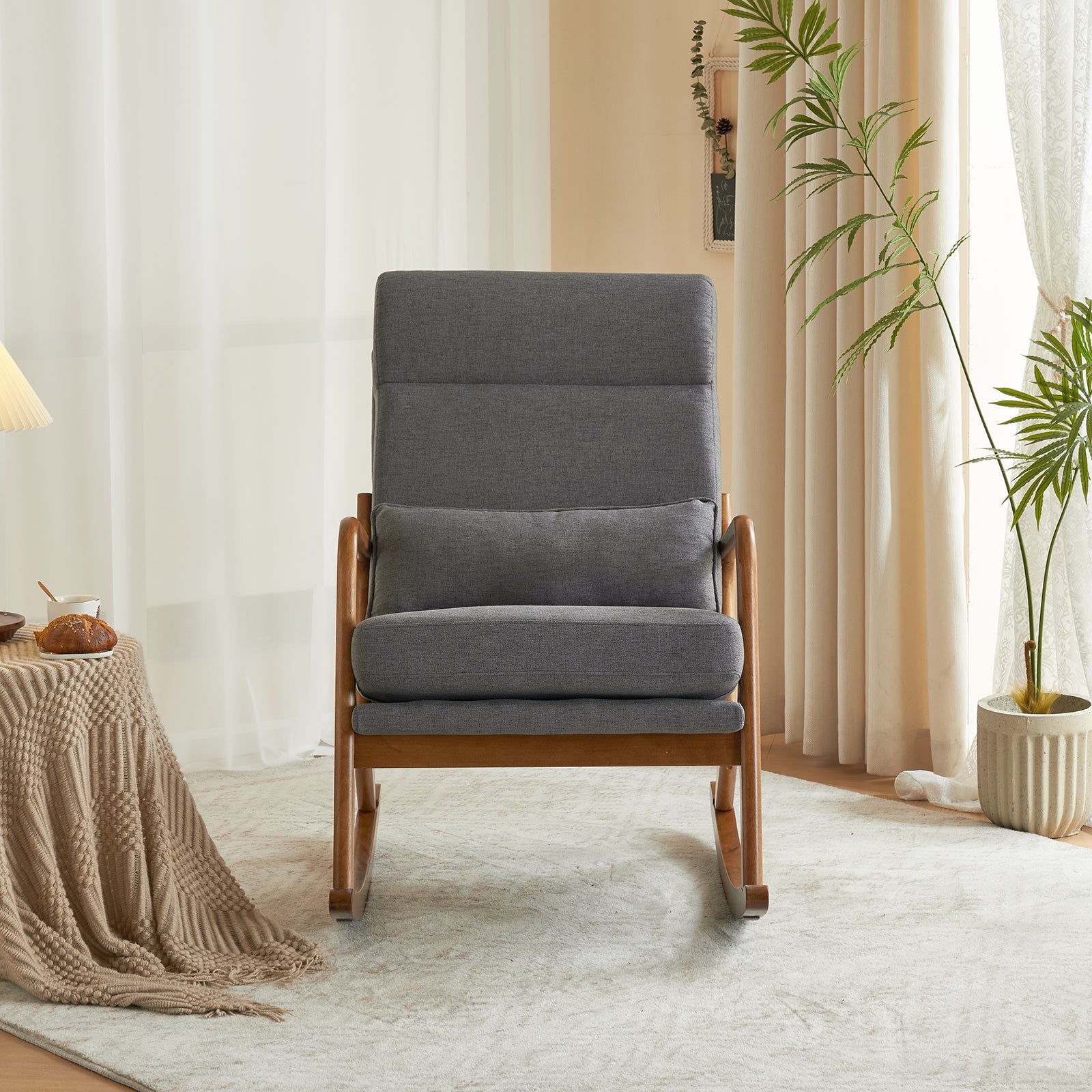 Front view of the grey linen indoor rocking chair, highlighting its elegance and comfort.