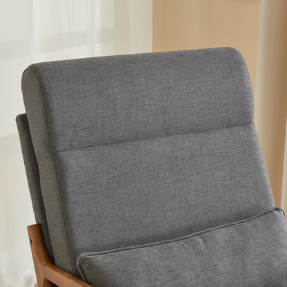 Close-up of the tall back cushion of the grey linen indoor rocking chair.