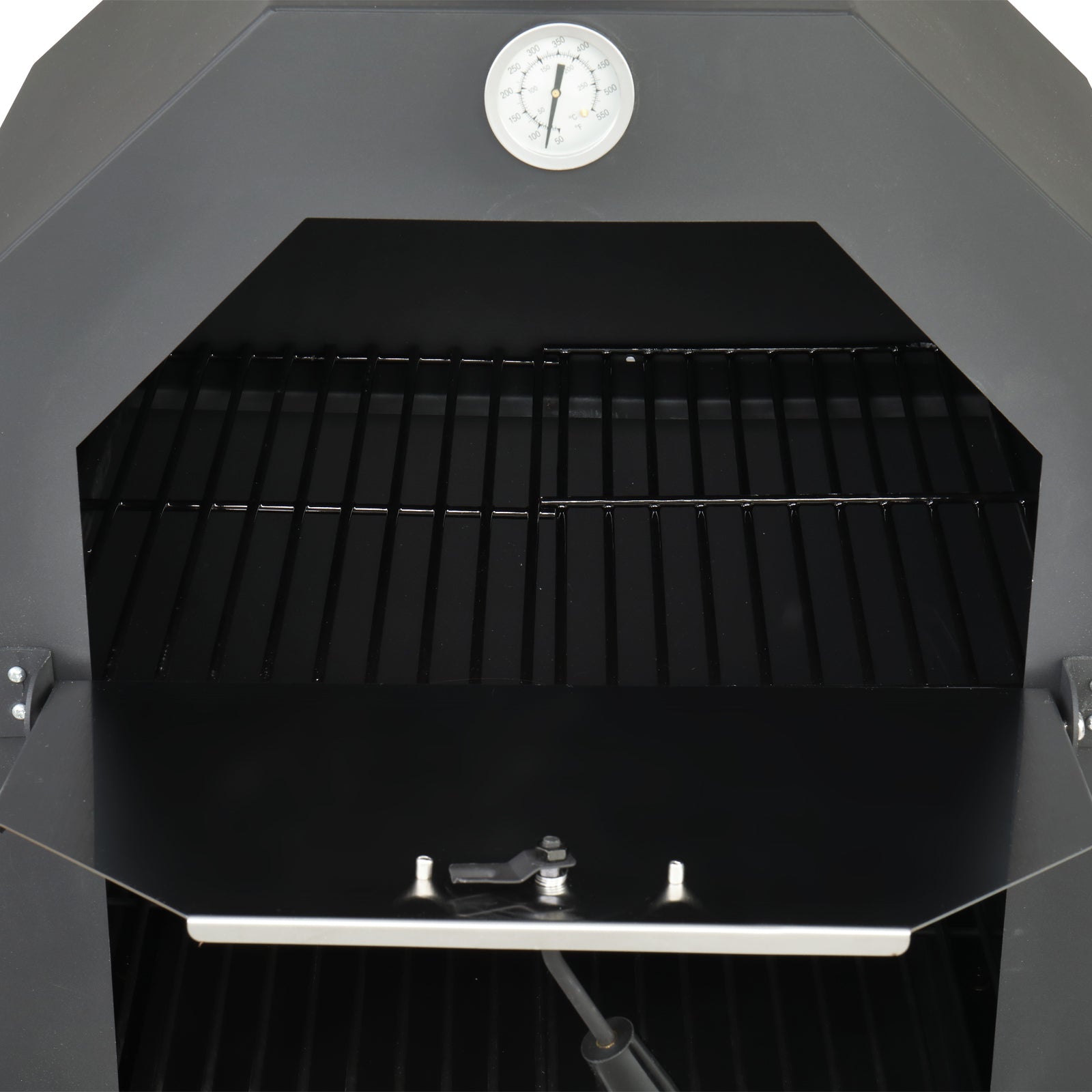 Pizza oven open to reveal durable grill grates