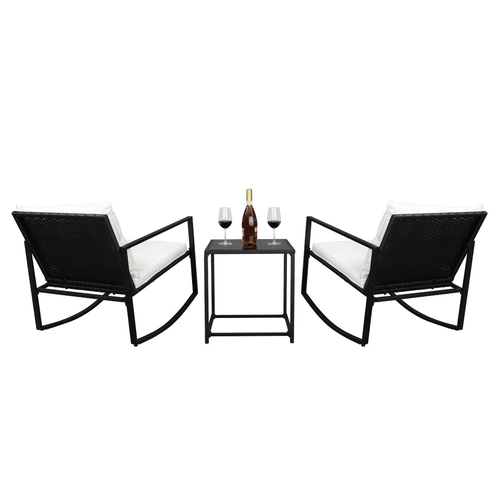 Back view of the rattan bistro set with comfortable rocking armchairs and cushions