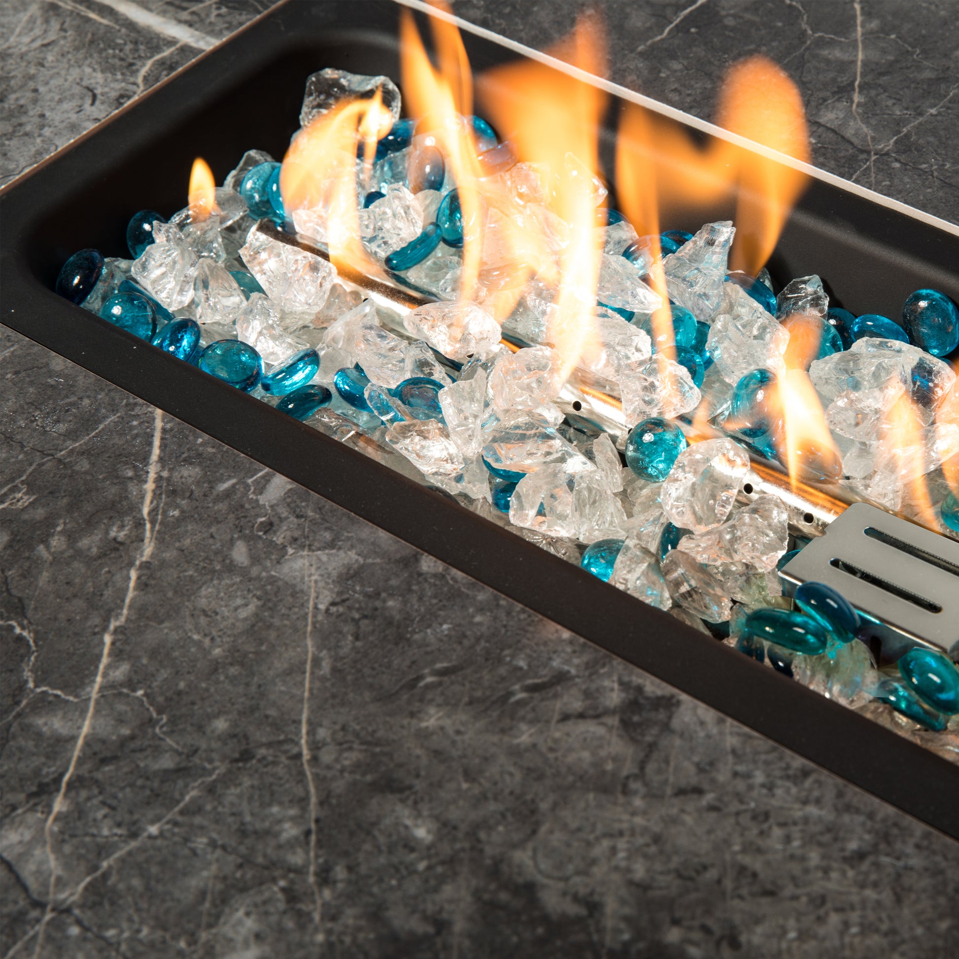 Colorful glass rocks for modern gas fire pit table, adding ambiance and style to your outdoor space.